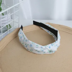 Floral fabric headband with knotted design, sweet blue flower pattern, wide hair hoop.