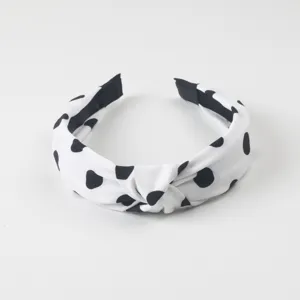 Serre-tête noué à pois noirs et blancs, accessoire de cheveux en tissu large et doux.