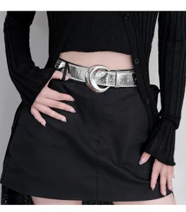 Silver shiny leather belt for women with unique metallic crescent buckle fashion accessory.