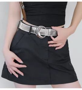 Silver metallic leather belt featuring a unique crescent moon buckle, stylish waist accessory.