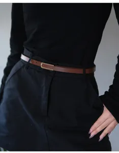 Thin brown leather belt for women, minimalist waist belt for jeans, stylish dress accessory.