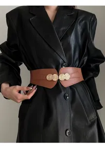 Detailed close-up view of the wide elastic waist belt featuring stunning gold metal buckle.