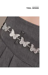 Silver metal butterfly waist chain detail shot, perfect for y2k sweet cool outfits and skirts.