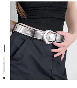 Silver metallic leather women belt with large round buckle stylish accessory for jeans dresses.