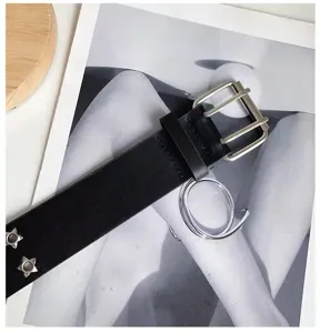 Punk style women black leather belt with metal double buckle, ring and star rivet details.