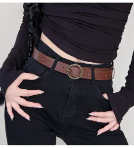 Retro brown leather belt for women with metal round buckle, stylish daily waist accessory.