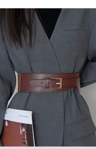 Brown wide leather belt for women, stylish waist cincher for blazer and coat styling.