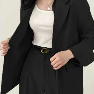 Women's slim leather belt with elegant metal pin buckle. Versatile black design for jeans and suits.