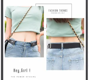 Detail shot of black elastic invisible belt with metal snap button worn with jeans securely.