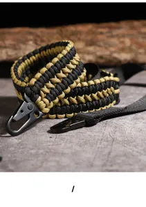 Close-up detail of black and gold paracord lanyard with sturdy metal carabiner hook.