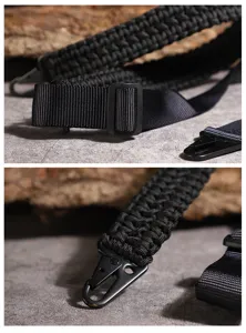Black woven paracord strap detail shot showing durable metal carabiner and adjustable buckle.