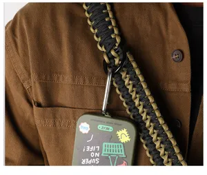Durable paracord lanyard keychain detail, featuring black and gold strap with sturdy hook.