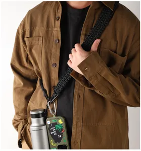 Durable black paracord lanyard strap with metal carabiner, ideal for outdoor carrying & gear.