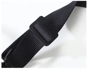 Black nylon strap detail with adjustable plastic buckle and metal ring for custom keychains.