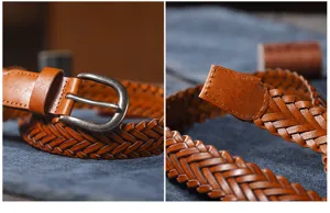 Close-up detail of brown woven leather belt showing fine braided texture and metal buckle.