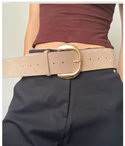 Retro suede wide waist belt detail showcasing the stylish metal buckle for trendy outfits.