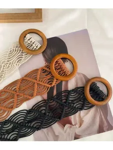 Bohemian handmade woven wax rope belt detail featuring natural wooden ring buckle craftsmanship.