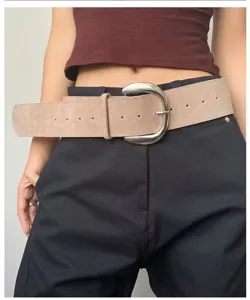 Retro wide suede waist belt detail with large silver metal buckle, stylish Y2K accessory.