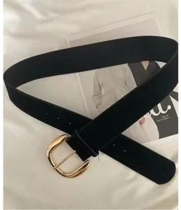 Retro black suede belt for women featuring a gold metal buckle. Ideal for casual everyday wear.