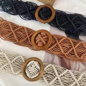 Hand-woven bohemian waist belt with round wooden buckle, stylish woven rope dress accessory.