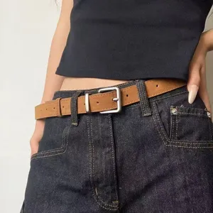 Women brown vintage belt with silver buckle slim waist accessory for stylish casual wear main view