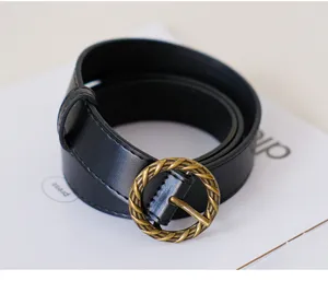 Women black retro belt with antique bronze round buckle, minimalist jeans belt style.