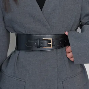 Wide black leather waist belt for women, stylish decorative cinch belt for coats and blazers.
