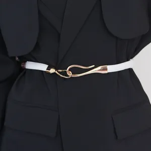 Women's white thin belt featuring gold hook buckle styled perfectly on black blazer