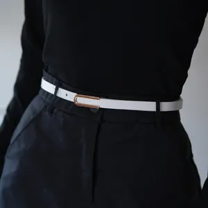 Stylish women's thin white leather belt with gold metal buckle, perfect for dresses and jeans.