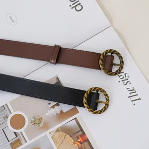 Retro women's belt featuring vintage twisted metal round buckle, stylish casual waist accessory.