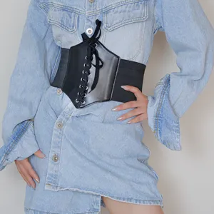 Wide black corset belt for women, elastic waist cincher matching stylish denim dresses and shirts.
