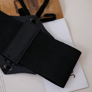 Black wide elastic corset belt for women, stylish waist cincher for dresses and shirts.