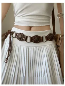 Closeup of vintage tribal retro brown leather metal ring studded belt detail view accessories