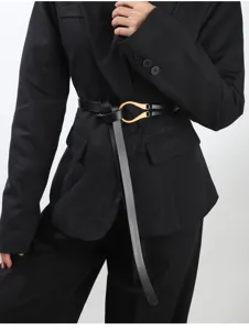 Elegant black leather belt with metallic U-shaped buckle, stylish knotted waist accessory.