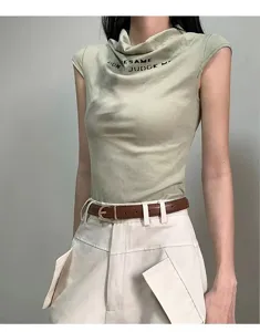 Sleeveless cowl neck top detailed with text print, paired with a stylish brown belt and pants.