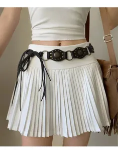Tribal vintage punk style belt accessory featuring metal rings, studs and tassel tie for women.