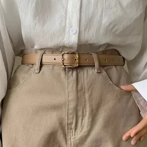 Women's minimalist faux leather belt with chic twisted square buckle versatile for trousers.