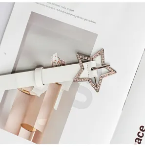 Close-up of white women belt featuring dazzling rhinestone star buckle for Y2K style.