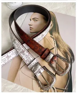 Retro western style women leather belt with carved metal buckle and vintage embossed pattern.