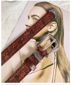 Vintage western embossed leather belt with ornate silver metal buckle for women boho style.