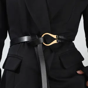 Elegant black leather waist belt with unique gold horseshoe buckle for women fashion dress