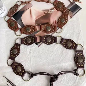 Boho retro leather waist belt with metallic rings and rivets, perfect for dresses and coats.