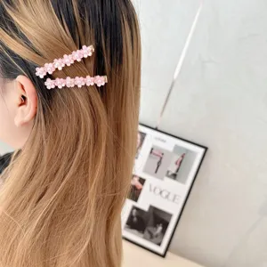 Sweet floral hair clips for women, stylish side bangs clips with pearl and rhinestone details.