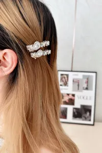Exquisite rhinestone side hair clip detail shot showing the sparkling crystal design.