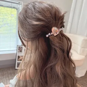 Elegant heart rhinestone hair clip detail view, fashion duckbill hairpin for women and girls.