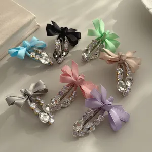 Detailed view of sweet Korean style bow rhinestone duckbill hair clips in multiple vibrant colors.