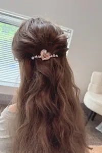 Detail view of the elegant heart rhinestone hair clip showing exquisite crystal decorations.