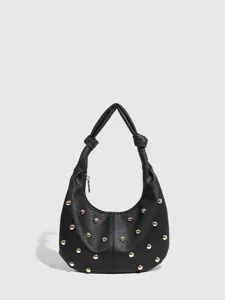 Black leather shoulder bag with gold metal studs and knotted handle detail for women.