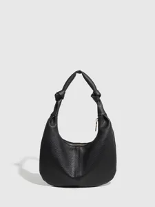 Minimalist black leather hobo shoulder bag for women featuring chic knotted handle and metal zipper.