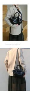 Niche pleated leather handbag for women, trendy commuter shoulder bag with elegant metal clasp.